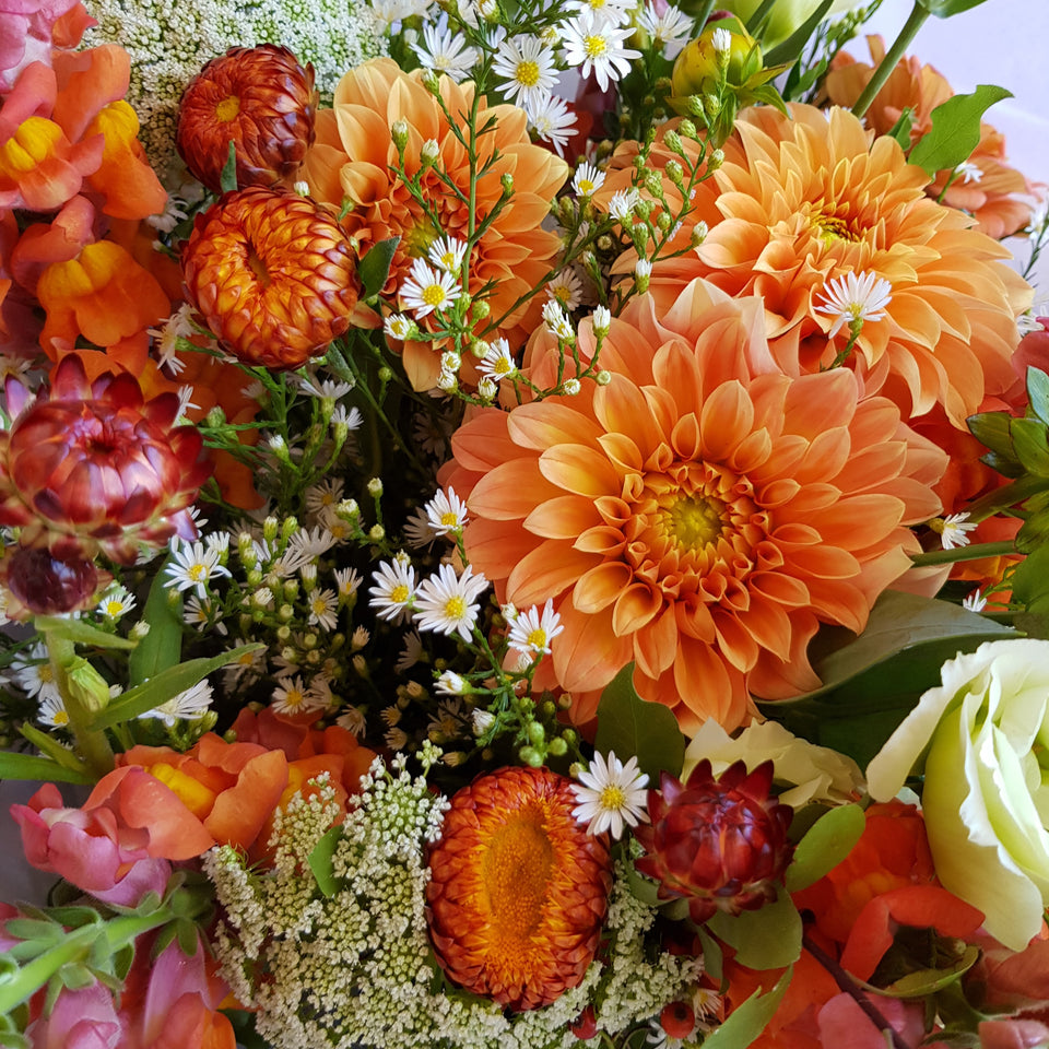 Vibrant autumn bouquet with dahlia, strawflower and snapdragons