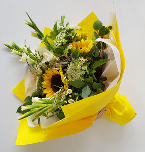 Bright bouquet with sunflowers and gladioli